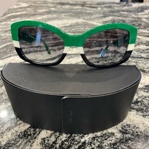 Authentic EUC Prada sunglasses with case.